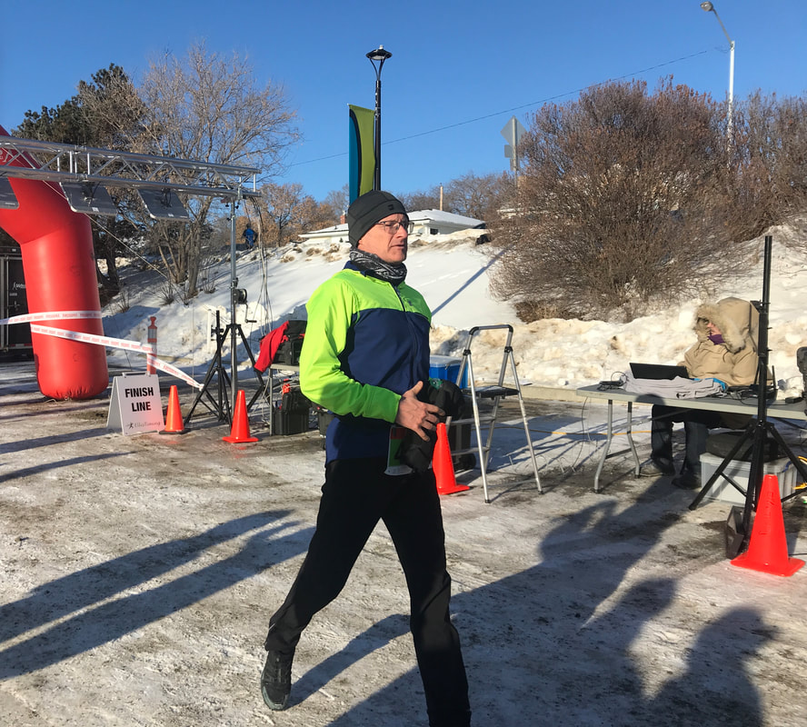Ed Gallagher crossing the finish line Edmonton Hypo Half 1 , Feb 2, 2020